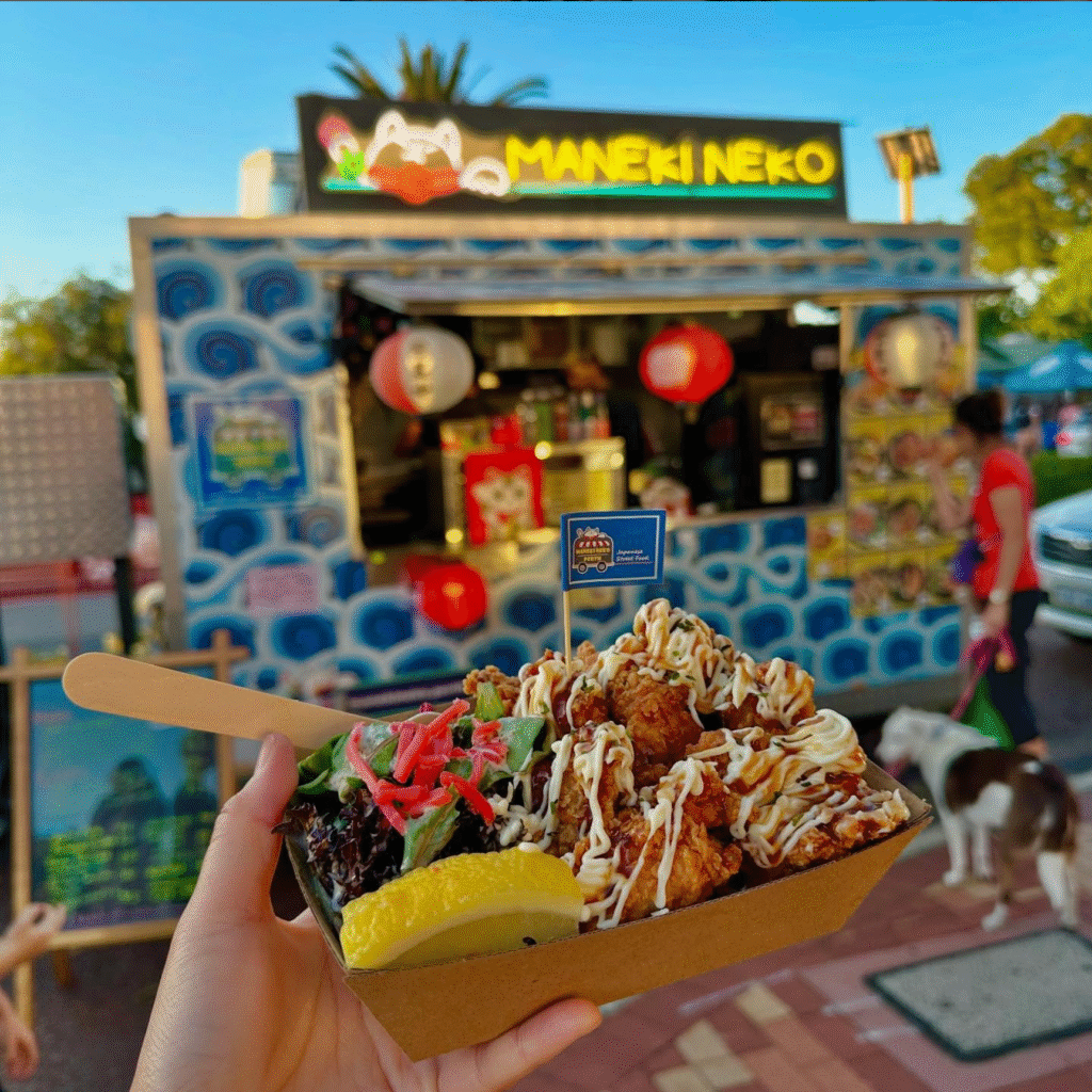 Maneki Neko Perth food truck serving crispy chicken karaage topped with Japanese mayo, pickled ginger, and lemon.